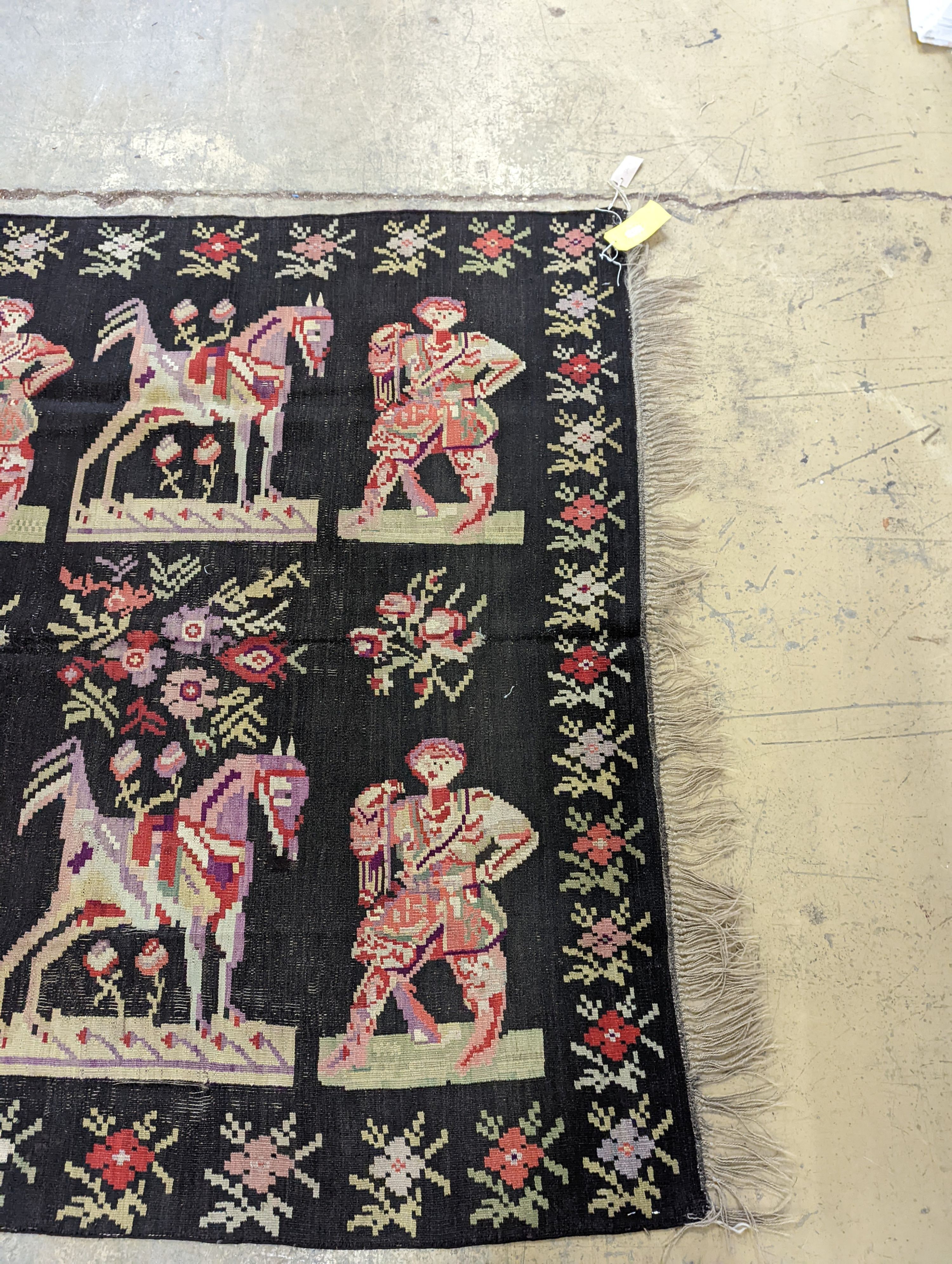An antique Ukranian flatweave carpet woven with figures and birds, approx. 350 x 170cm